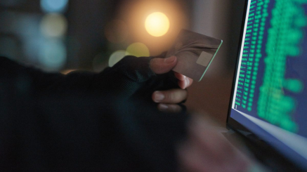 theft-hands-hacker-with-credit-card-with-laptop-screen-numbers-illegal-money-laundering-payments-cyber-security-male-person-stealing-capital-from-account-with-online-software